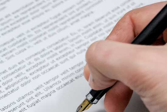 Real Estate Legal Document Signing signing legal doc with fountain pen